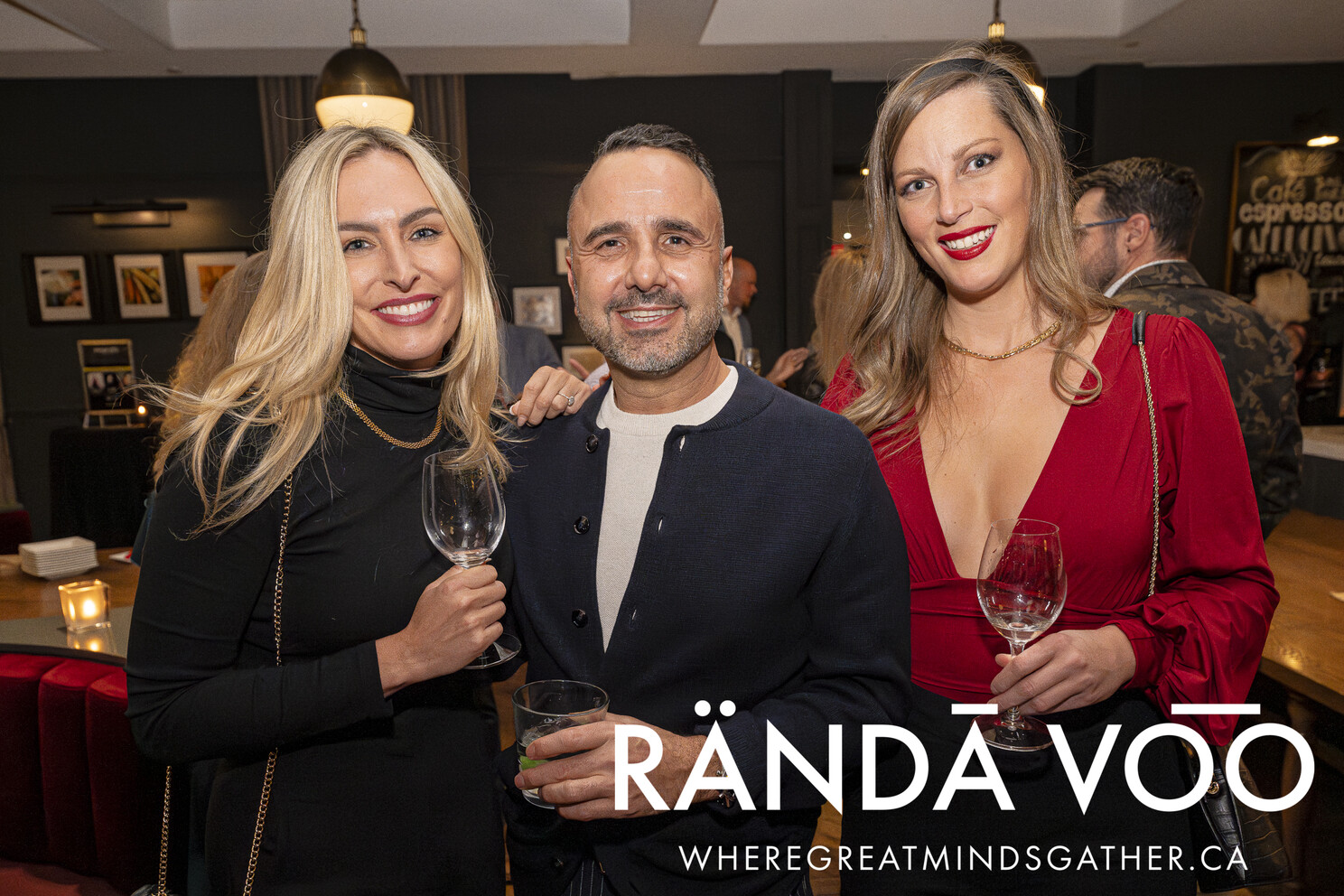 Three guests together with drinks at the Business. Bubbles. Seafood reception.