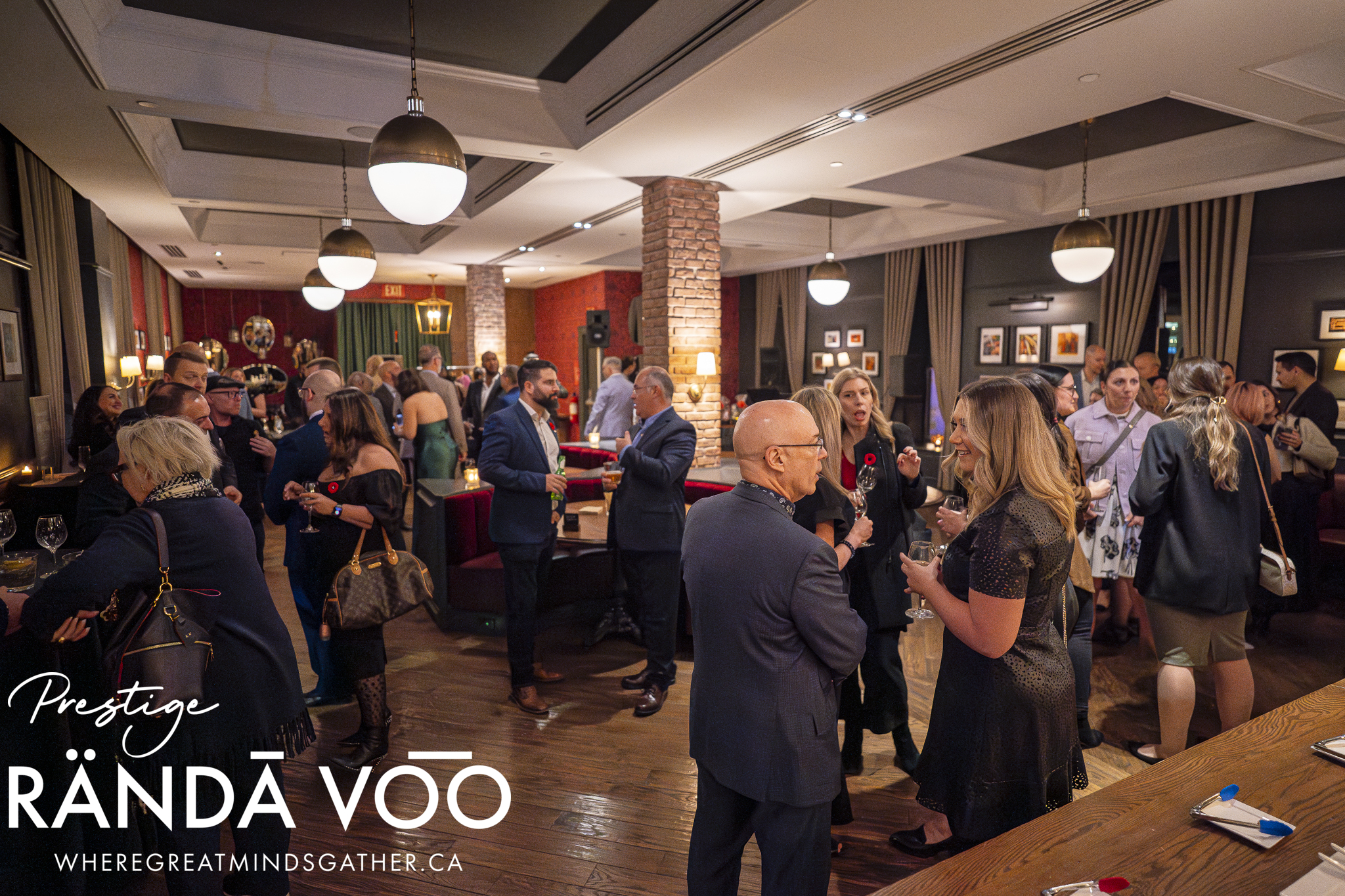 Guests in conversation throughout the Albion Rooms at Business. Bubbles. Seafood, with RÄNDĀ VO͞O branding.