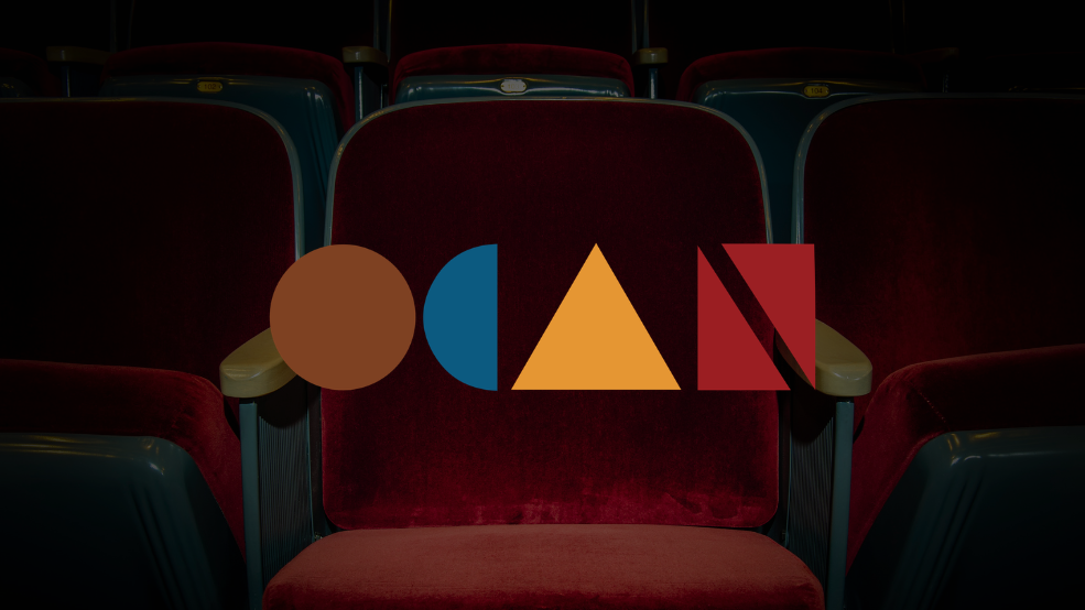 OCan festival logo over rows of red cinema seats.