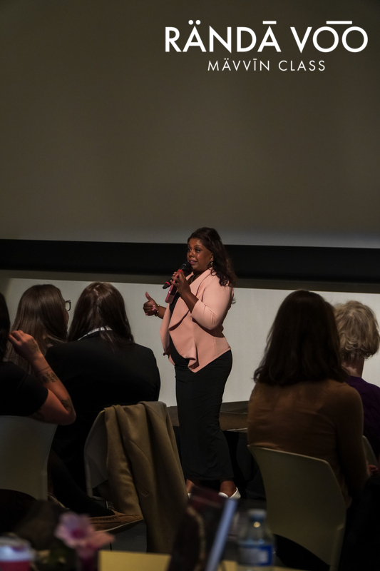 Samantha Moonsammy speaking among seated guests while moderating MÄVVĪNCLASS The Capacity Room.