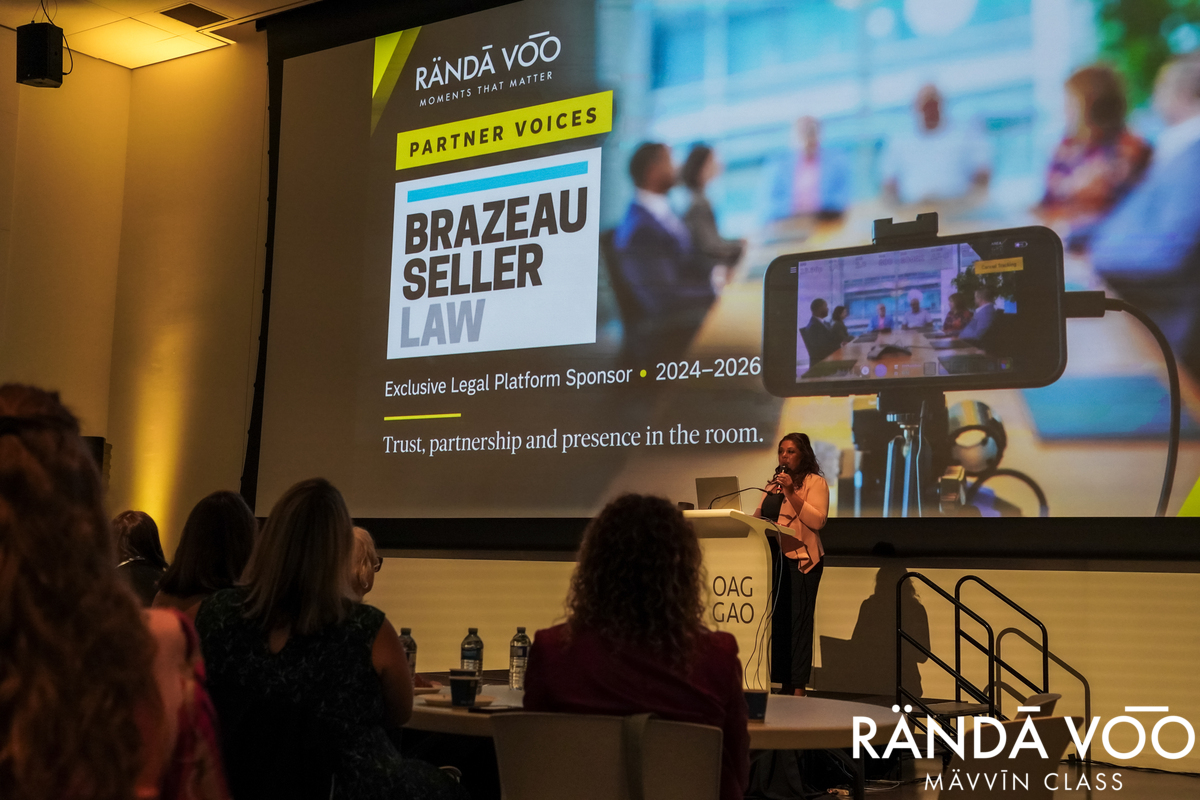 Samantha Moonsammy at the lectern with a Brazeau Seller Law partner slide projected behind her.