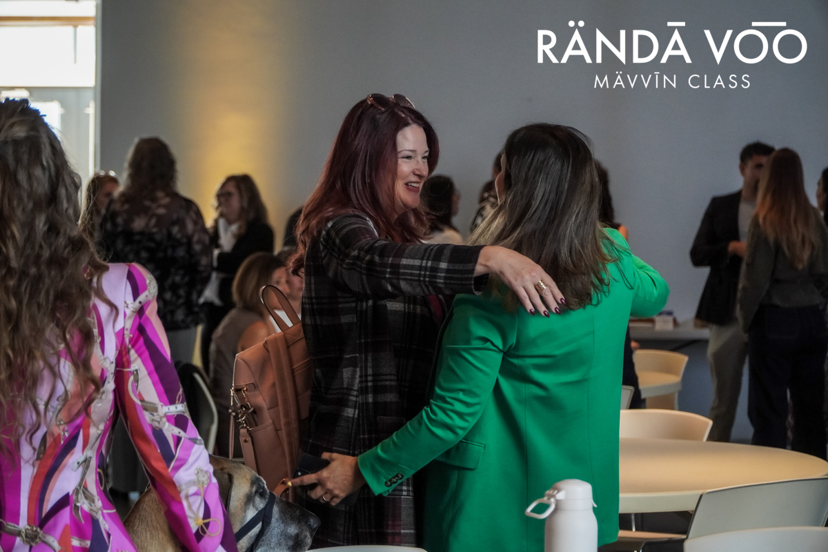 Guests greeting one another during opening networking at MÄVVĪNCLASS The Capacity Room.
