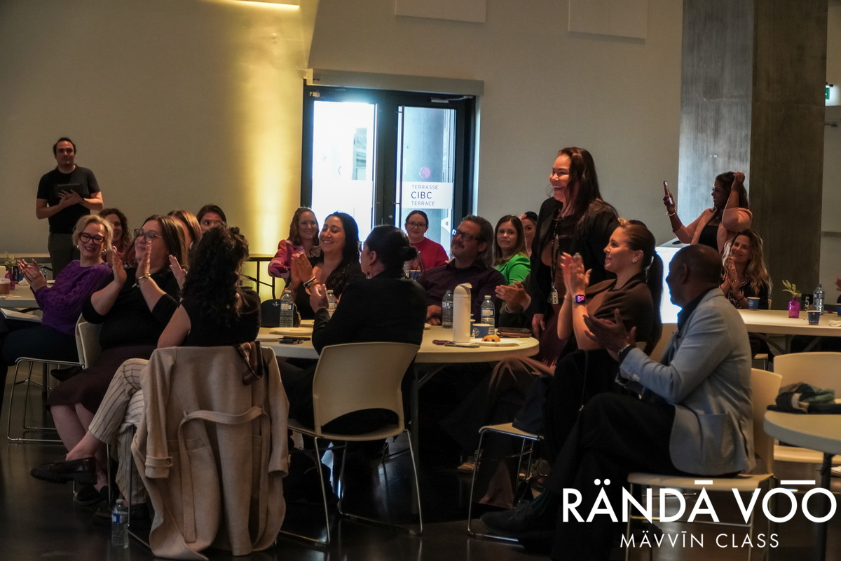 ADAAWE Business Hub and friends applauding and cheering Sunshine Tenasco at The Capacity Room.