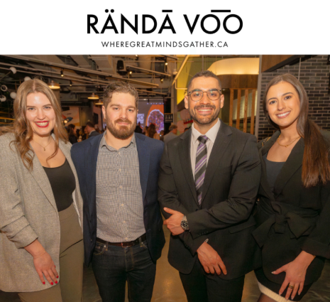 Four guests gathered for a photo at Queen St. Fare beneath RÄNDĀ VO͞O branding.