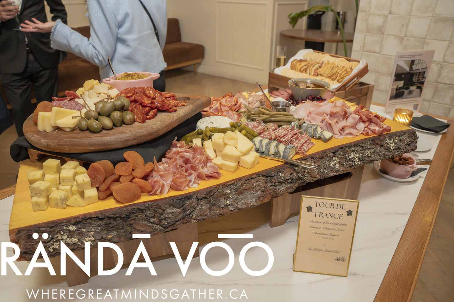 A French-inspired charcuterie spread with cheeses, cured meats, and bread.