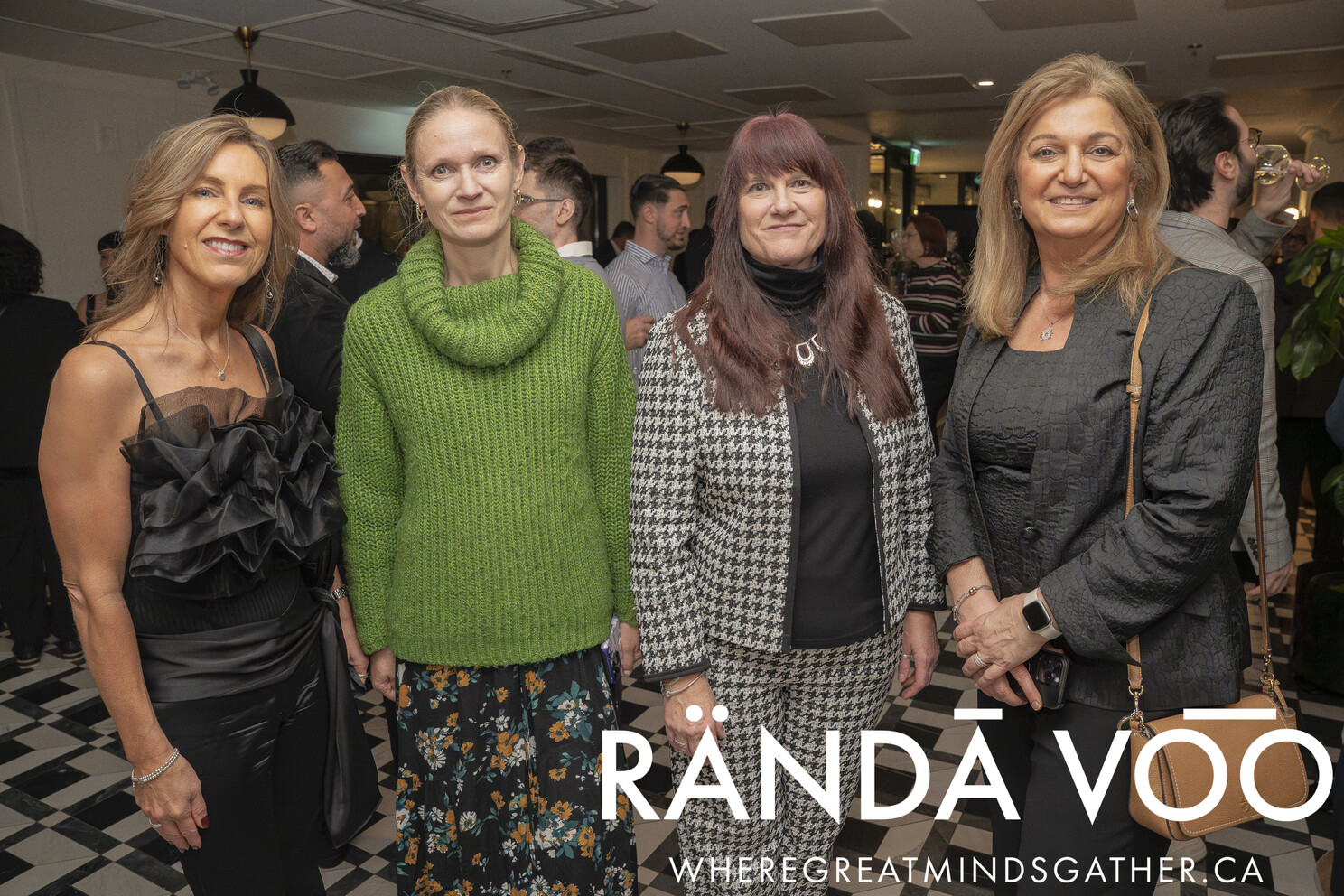 Four guests gathered for a photo at the grand finale reception.
