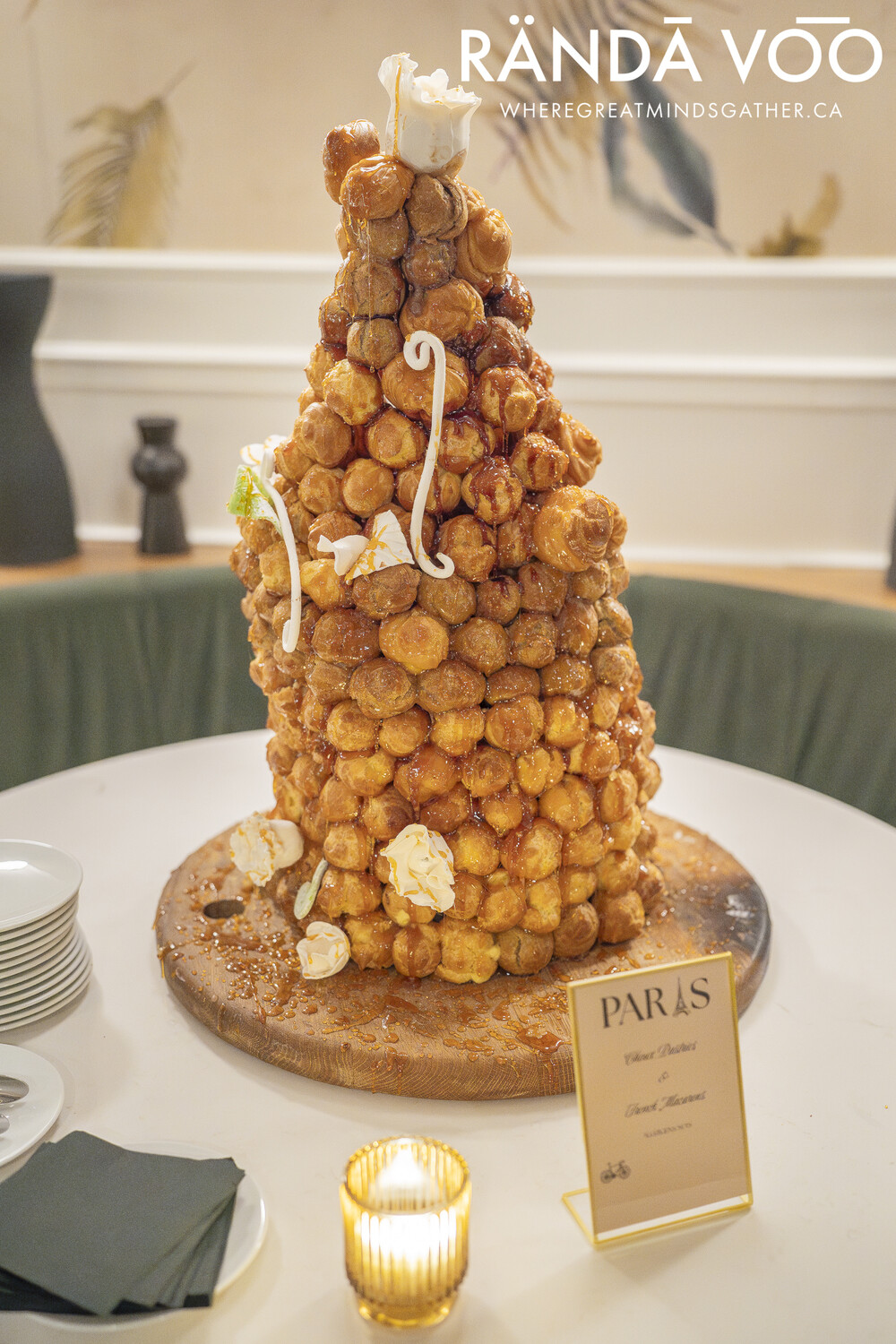 A tall croquembouche pastry tower at the grand finale’s Paris-themed culinary display.