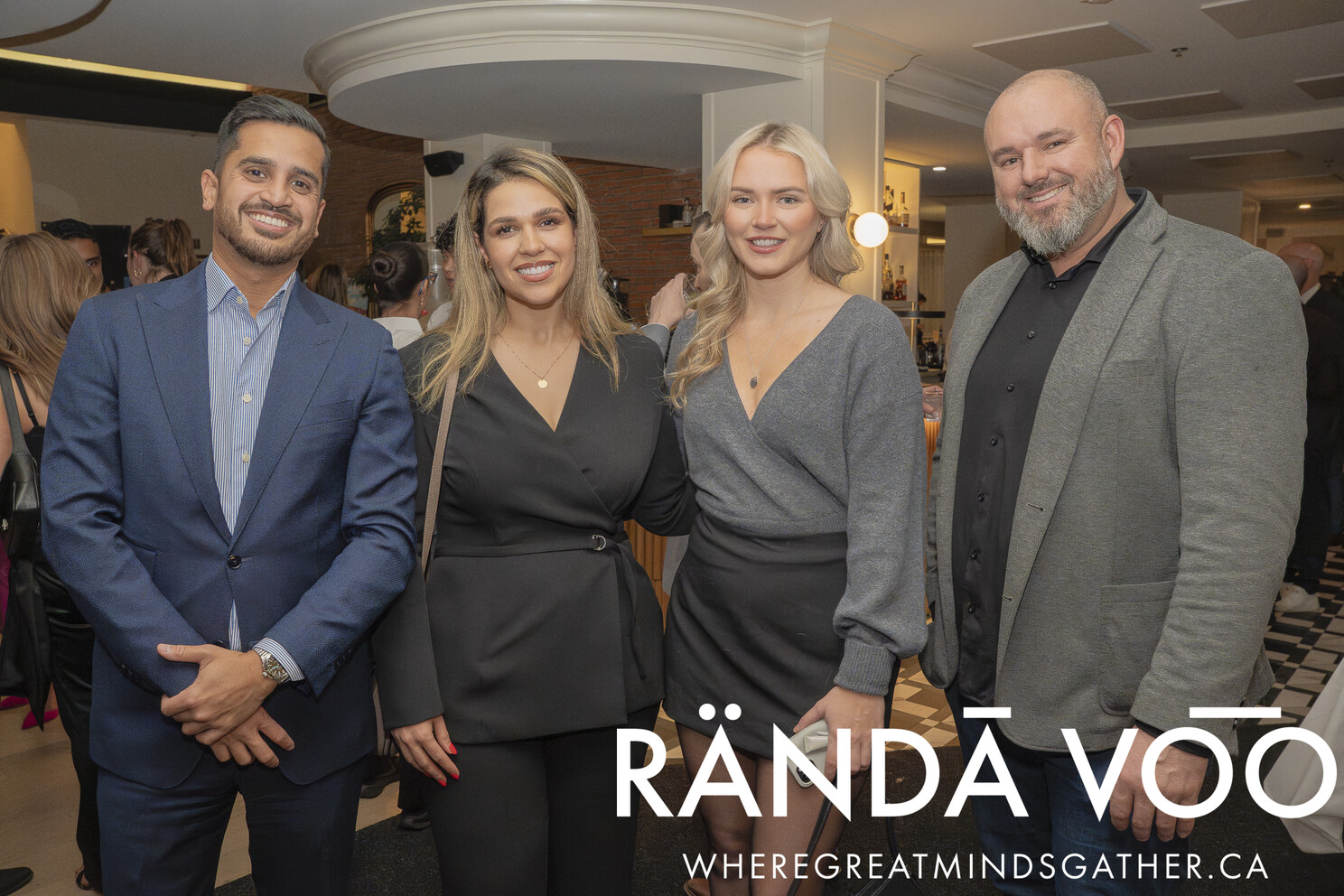 Four guests posing together at the Tour Du RÄNDĀ VO͞O grand finale.
