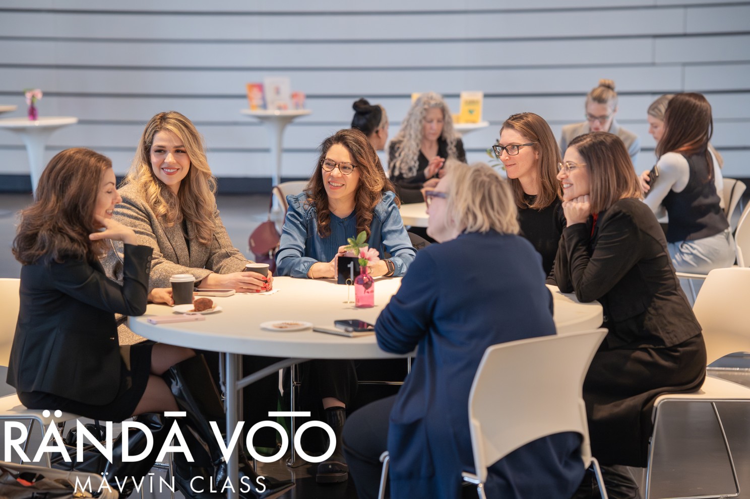 MÄVVĪNCLASS guests sharing a discussion at a round table.