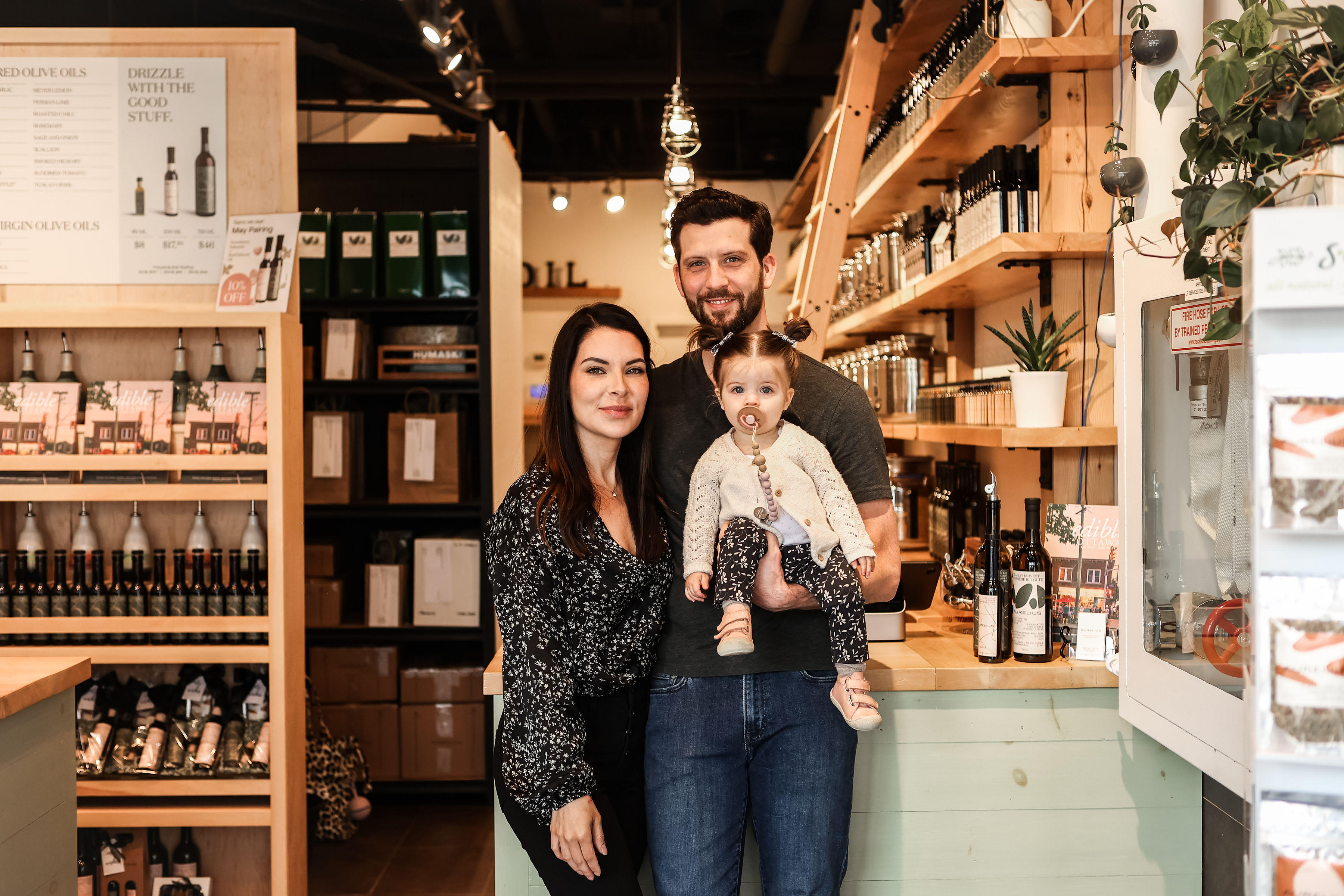 Mike George with his family inside an Aurelius Ottawa boutique.
